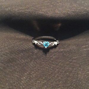 Described on purchase as Heart Shaped Sterling Silver Blue Topaz Ring